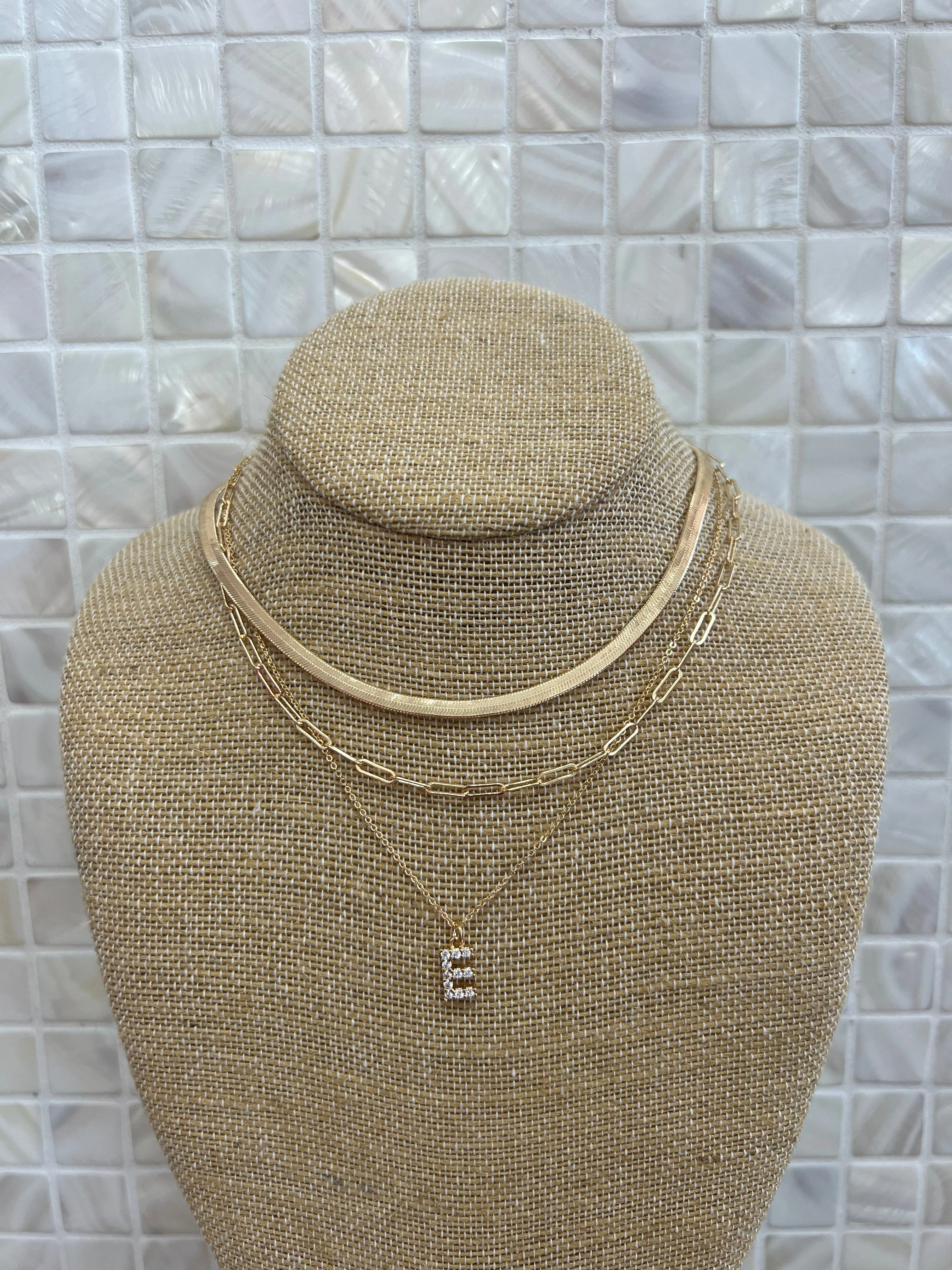 GOLD SNAKE, PAPERCLIP, AND CRYSTAL PENDANT INITIAL LAYERED NECKLACE